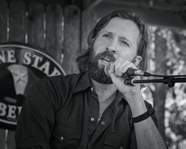 Owen Temple performing in Luckenbach Texas - Image 1